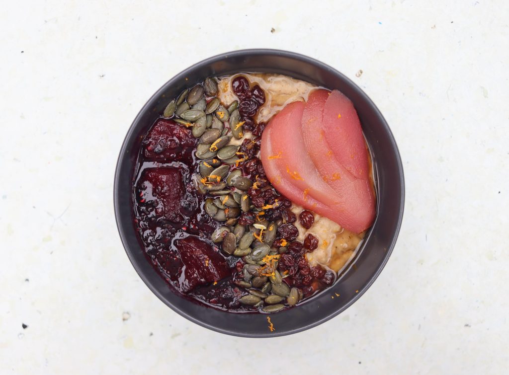 Porridge with hibiscus pear and berry compote - Common Ground